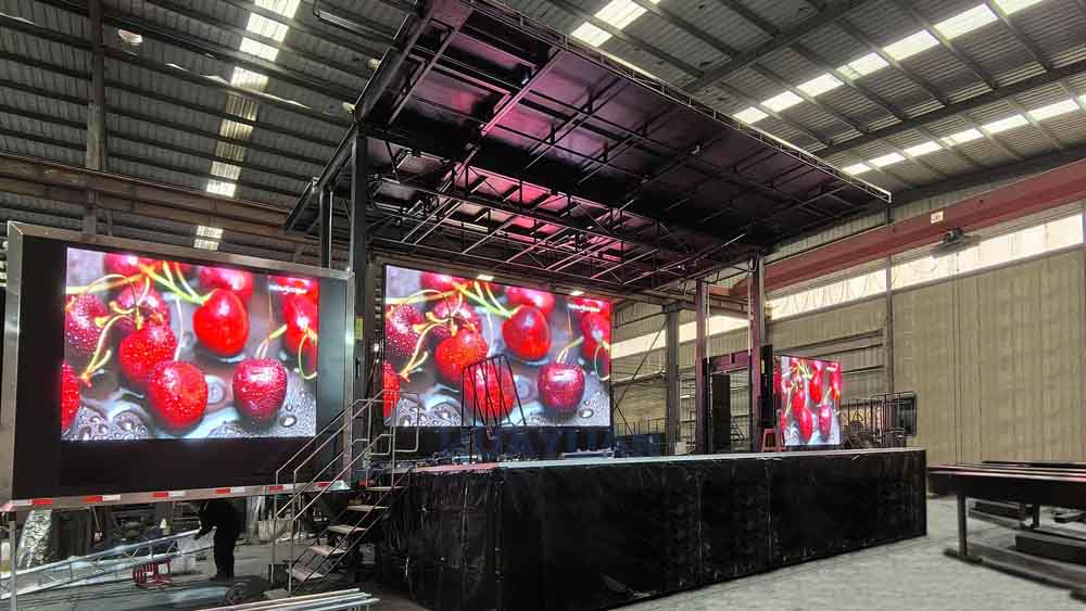 Mobile stage with LED screens and event equipment configuration